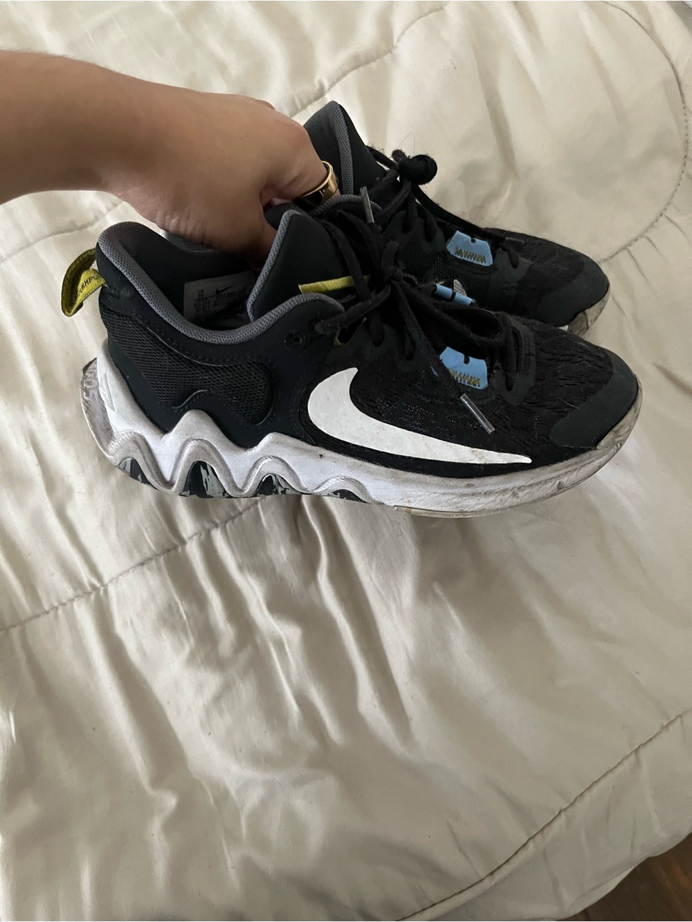 Nike Kids Black Sneakers with White Swoosh and Yellow Accents